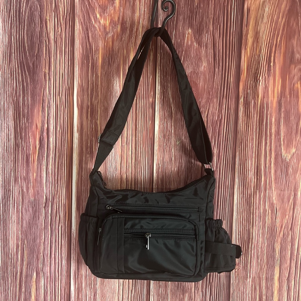 Vinyl crossbody bag with water bottle storage